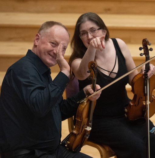 players wave to audience